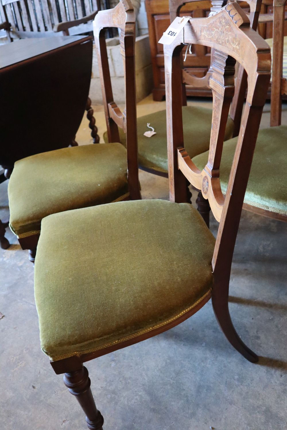 A set of four Victorian inlaid walnut dining chairs